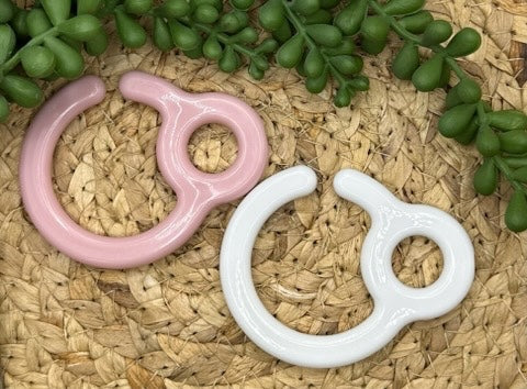 Clip/crochet pour poussette
