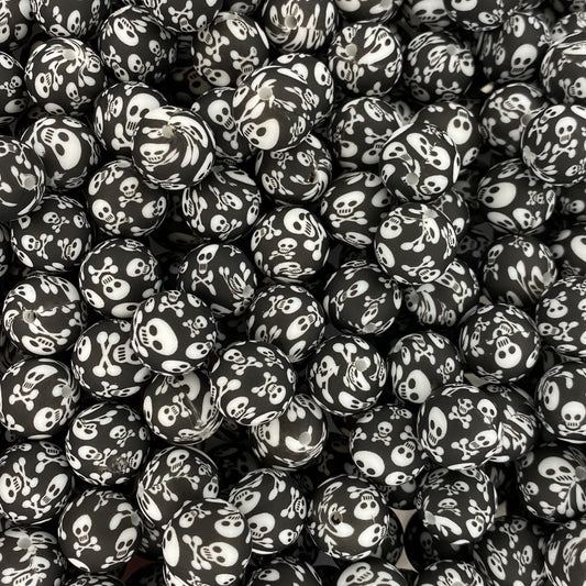 Perle de 15 mm imprimée tête de mort et os croisés
