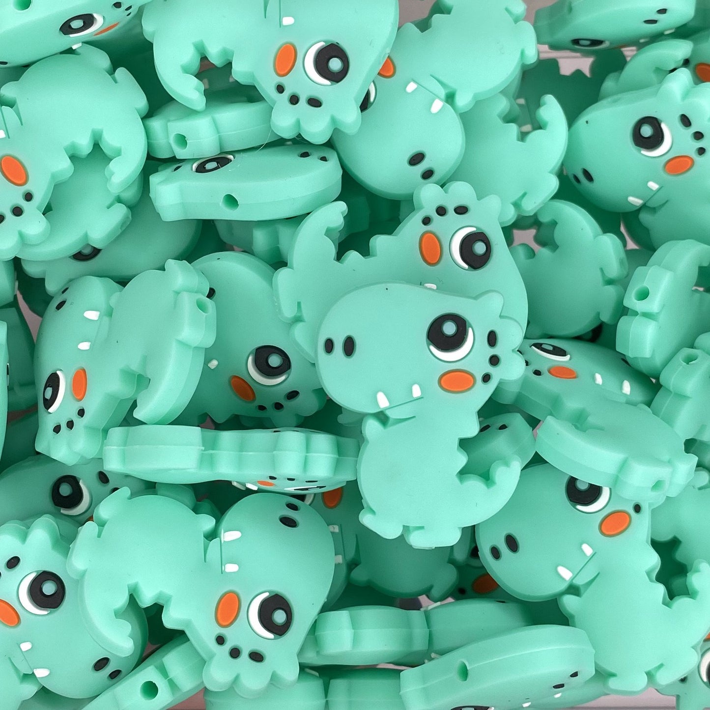 Perle focale Dino dansant