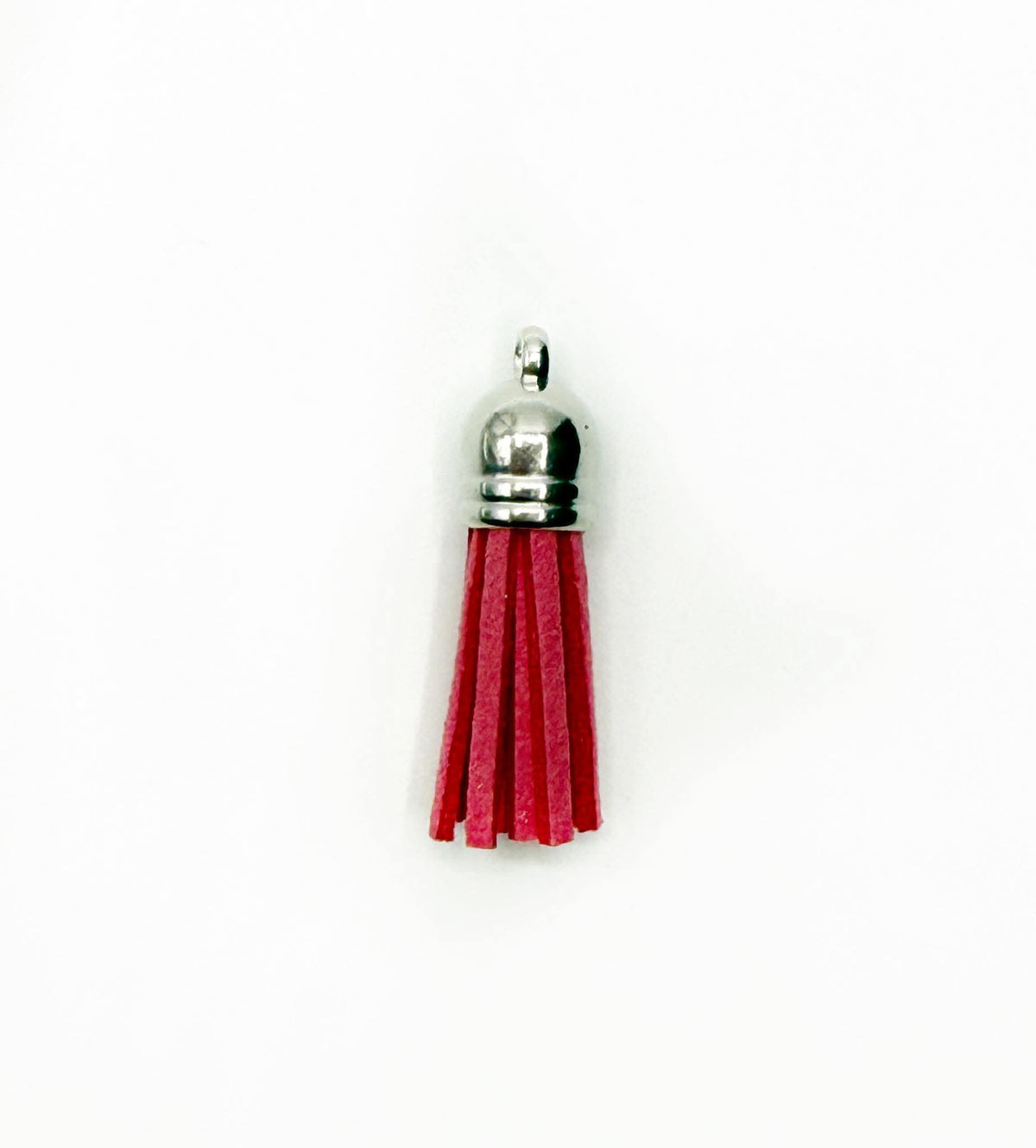 Petits pompons en cuir argenté