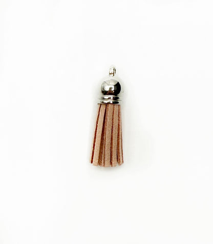 Petits pompons en cuir argenté
