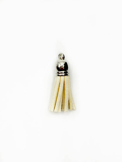 Petits pompons en cuir argenté