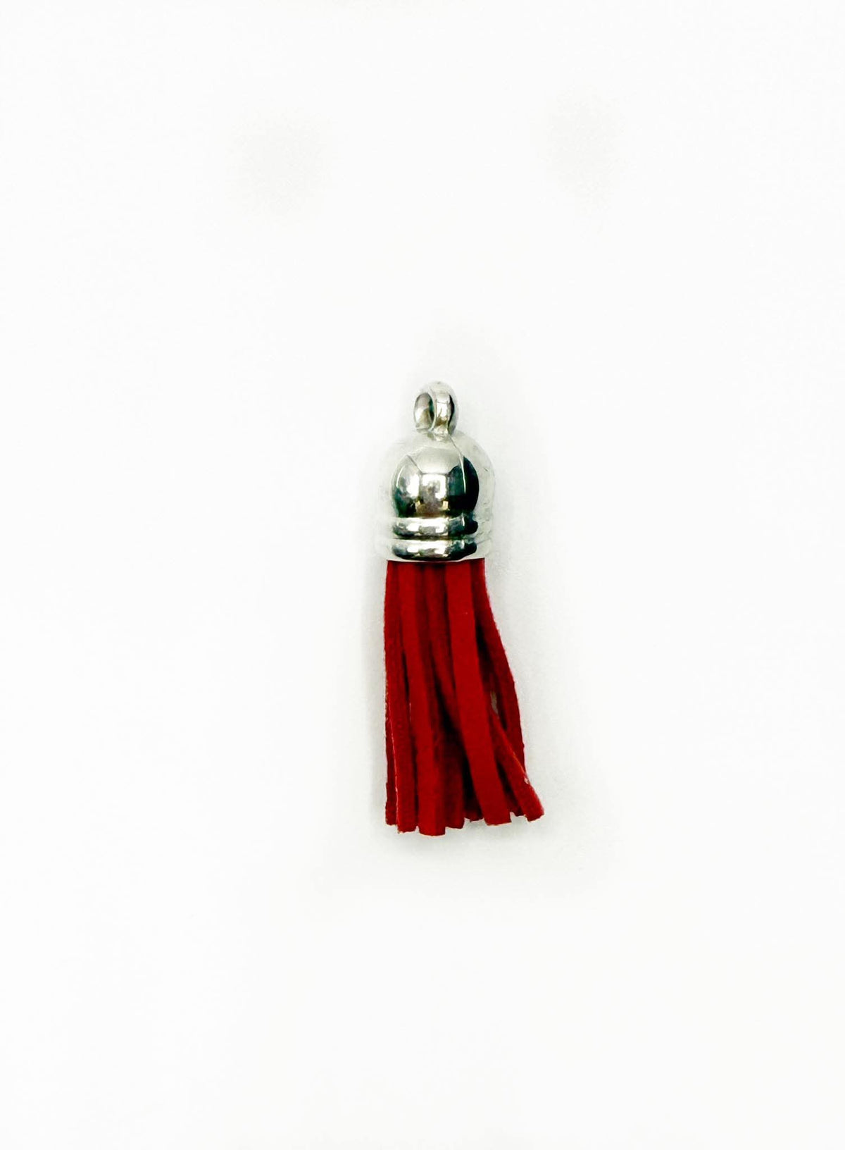 Petits pompons en cuir argenté
