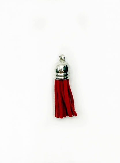 Petits pompons en cuir argenté